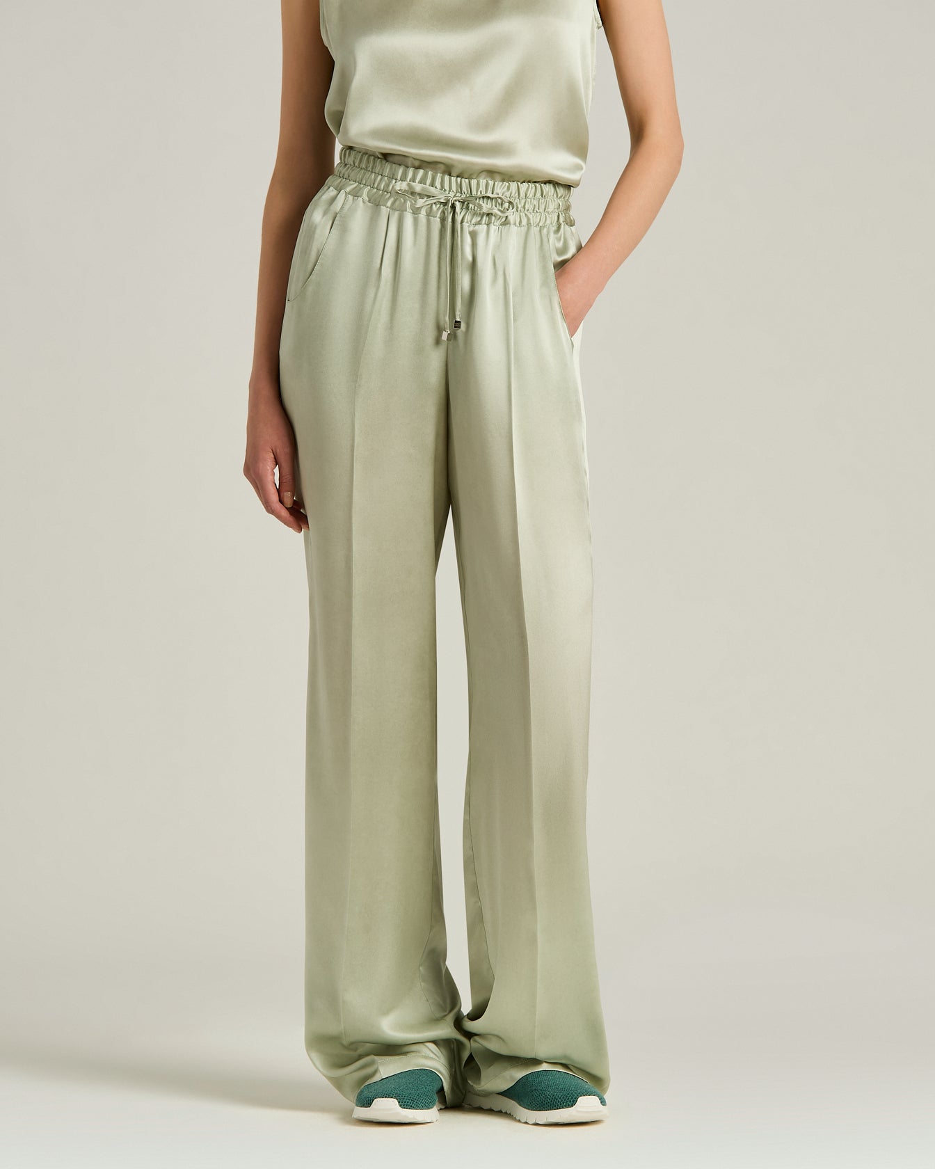 Women's fluid silk satin trousers in green | Kiton