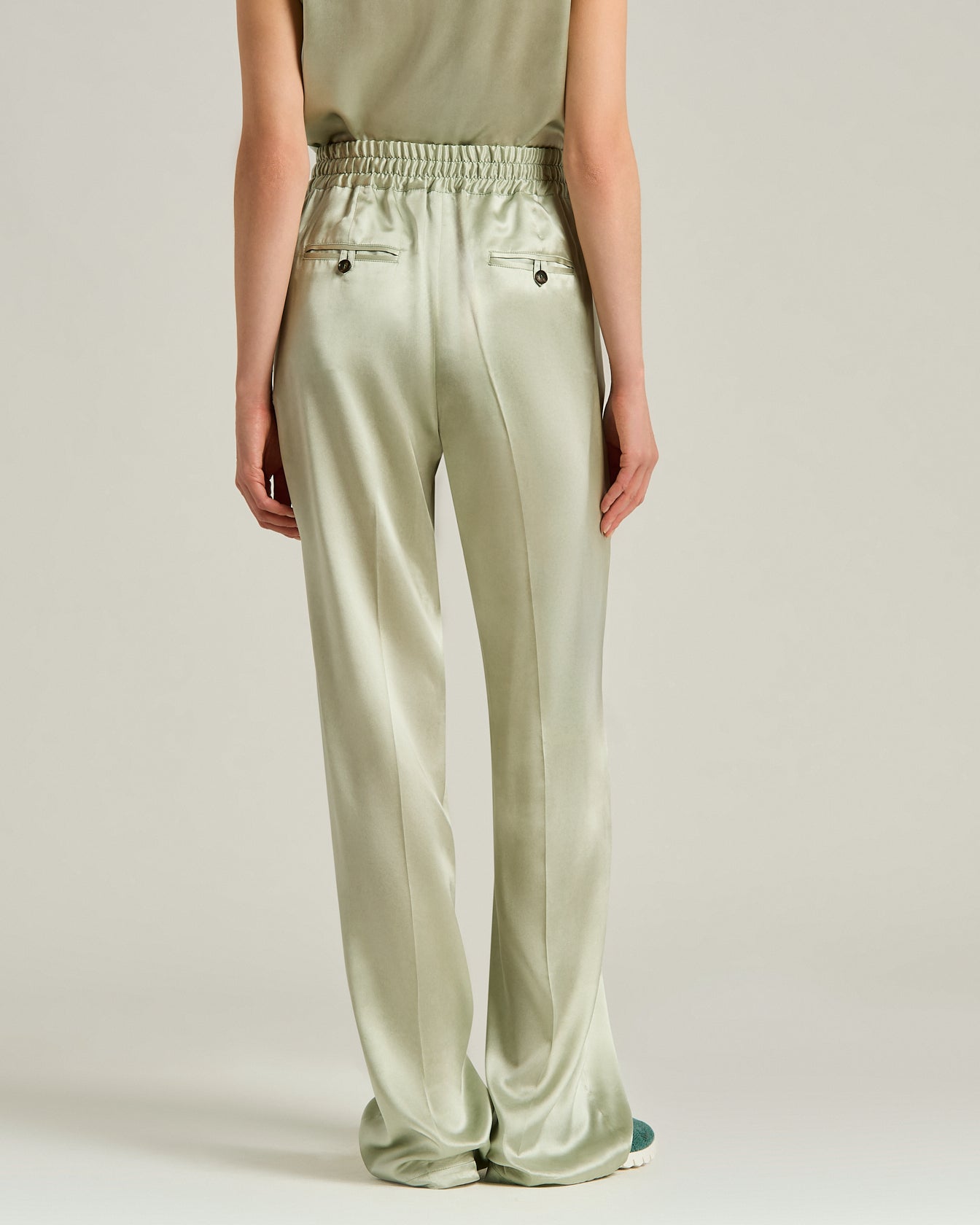 Women's fluid silk satin trousers in green | Kiton