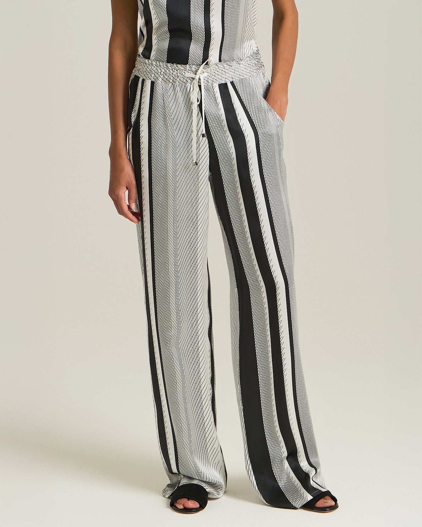 SILK TROUSERS WITH PRECIOUS STITCHES PATTERN