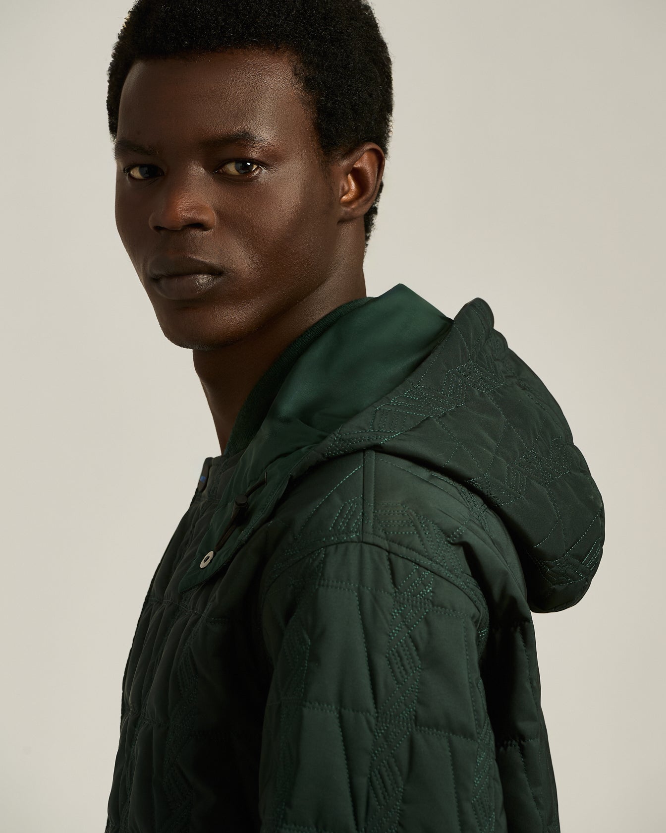 QUILTED TECHNICAL OVERCOAT WITH HOOD